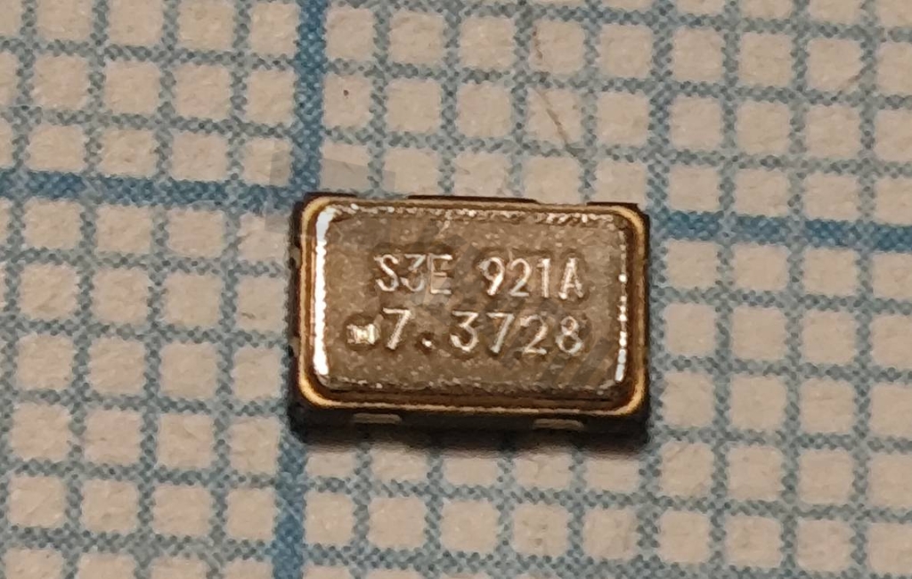 Кварцевый генератор 7372.8 КГц - S1633E-7.3728-T SMD0503M4-4 3.3в CMOS Low Jitter XO